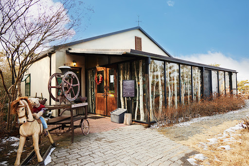 Chungju Coffee Museum building with its antique grinder wheel out front