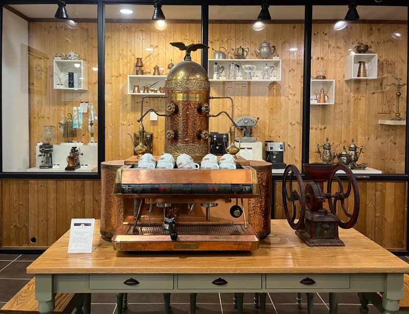 Ornate copper espresso machine on display