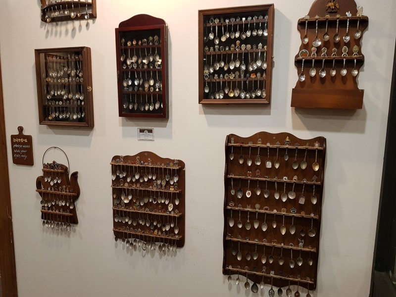 Wall of collected souvenir spoons