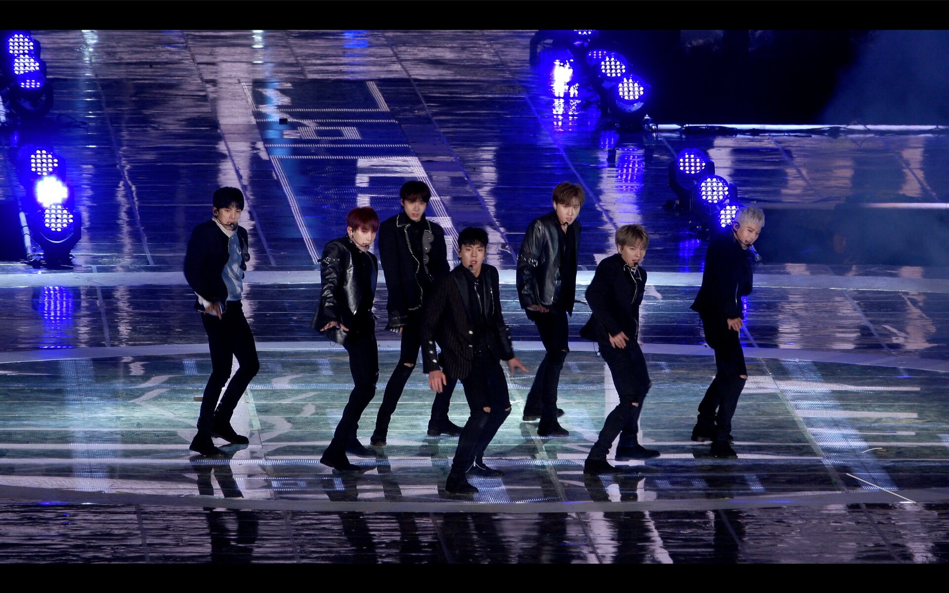 K-pop performance under blue stage lights