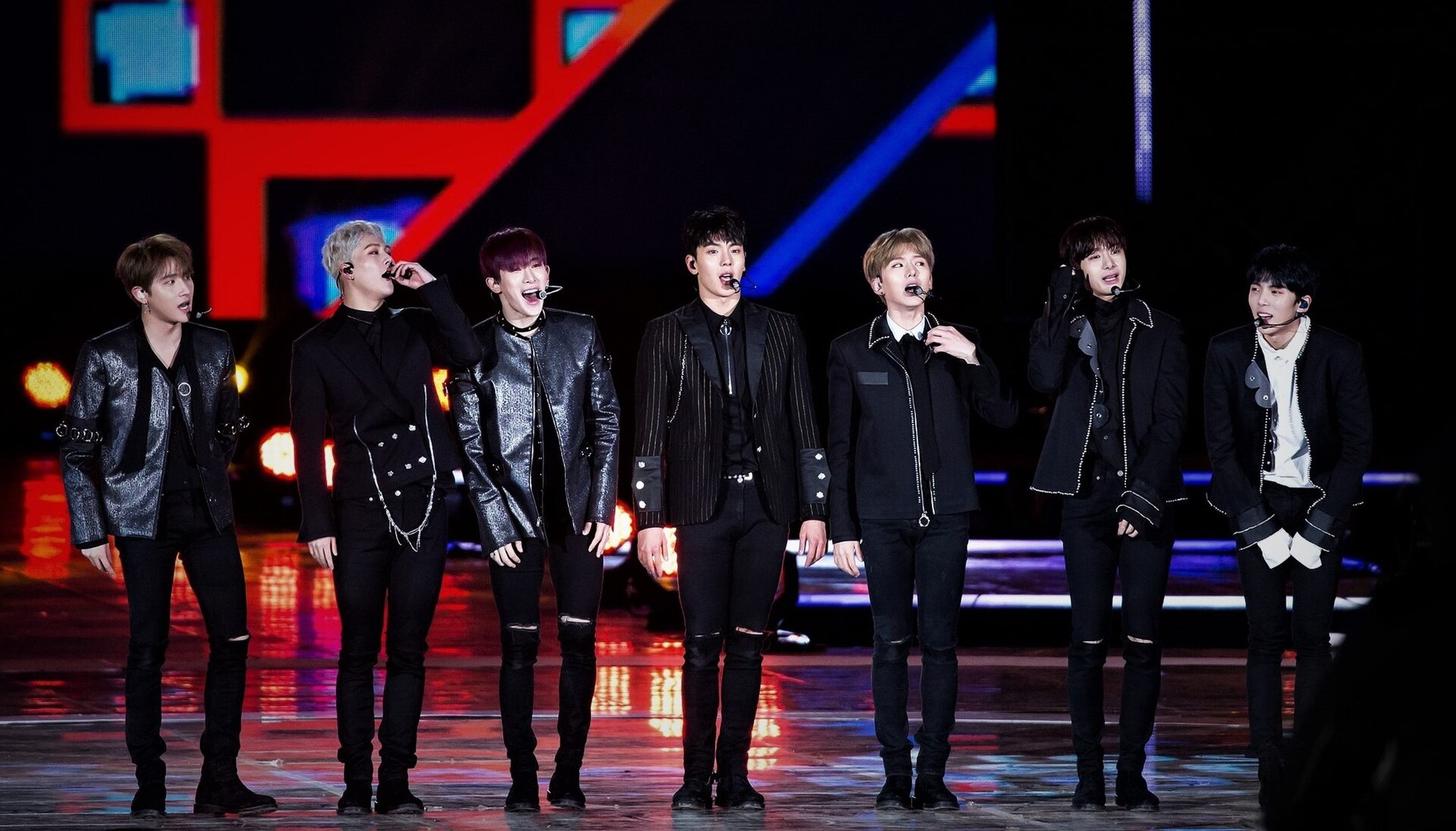 K-pop boy group on stage at night