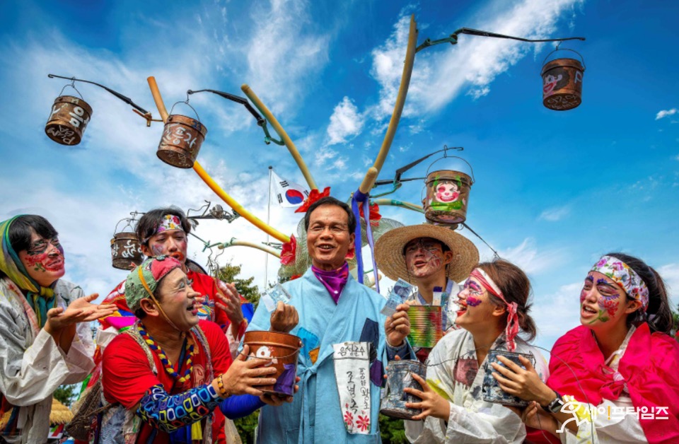 Performers celebrating under festival decorations
