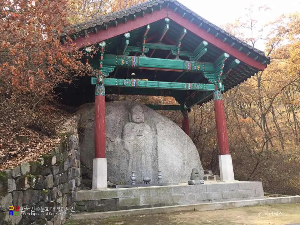 The Goryeo-era rock-carved Buddha of Mitasa under its protective pavilion