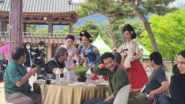 Seonbi Festival scholars seated with hanbok performers